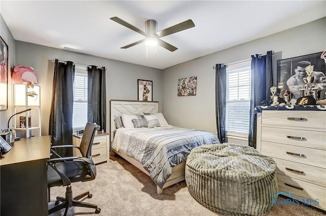 bedroom featuring ceiling fan and light carpet