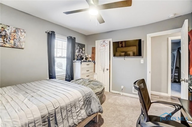 carpeted bedroom with ceiling fan