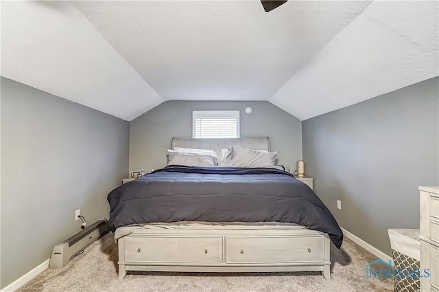 carpeted bedroom featuring a textured ceiling and vaulted ceiling