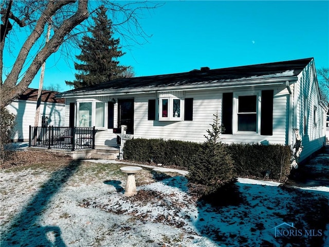 single story home with covered porch