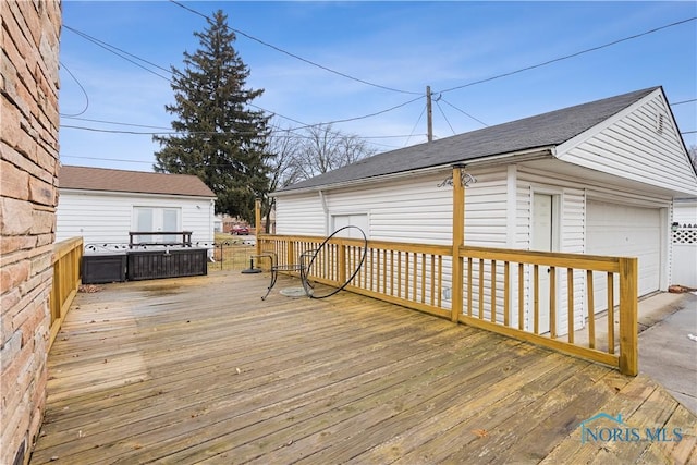 wooden terrace featuring a garage