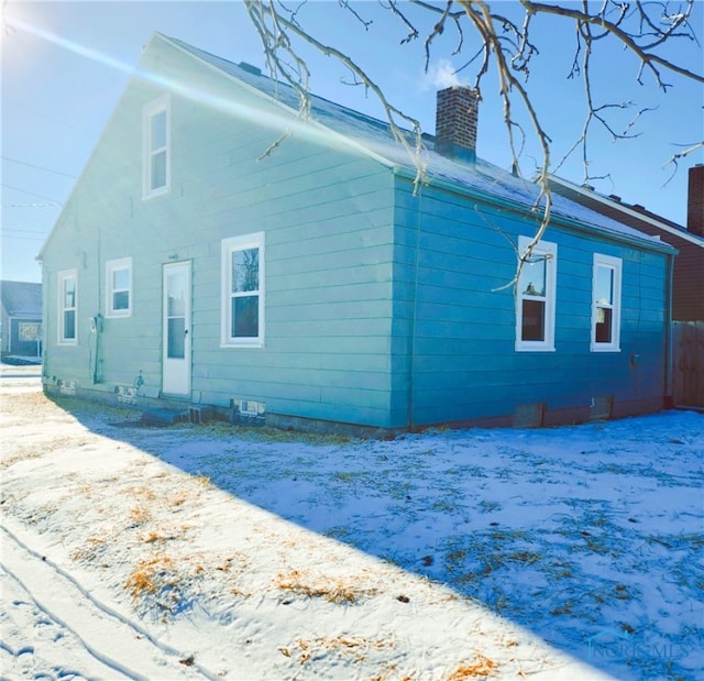 view of snow covered house