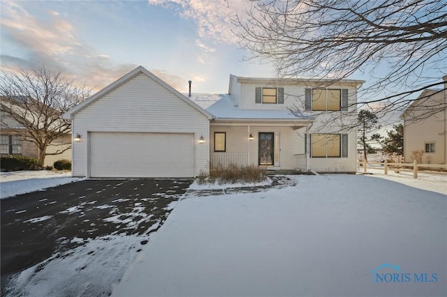 view of front of home with a garage