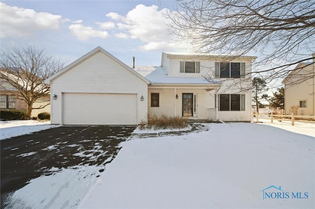 front of property with a garage