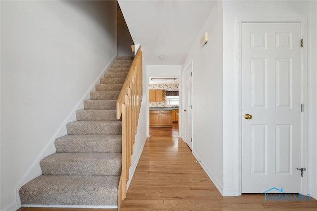 stairway featuring hardwood / wood-style floors