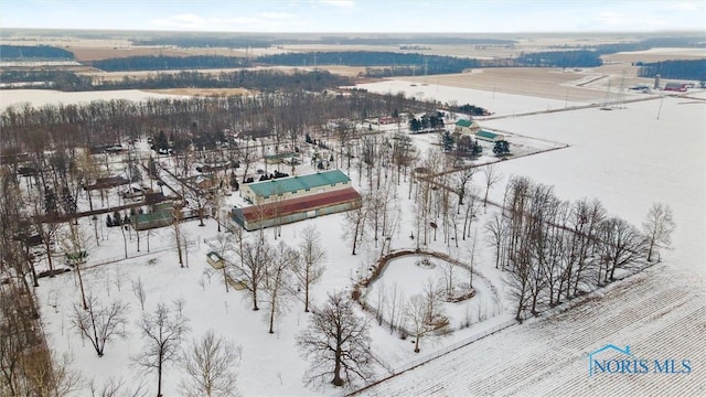 snowy aerial view featuring a rural view