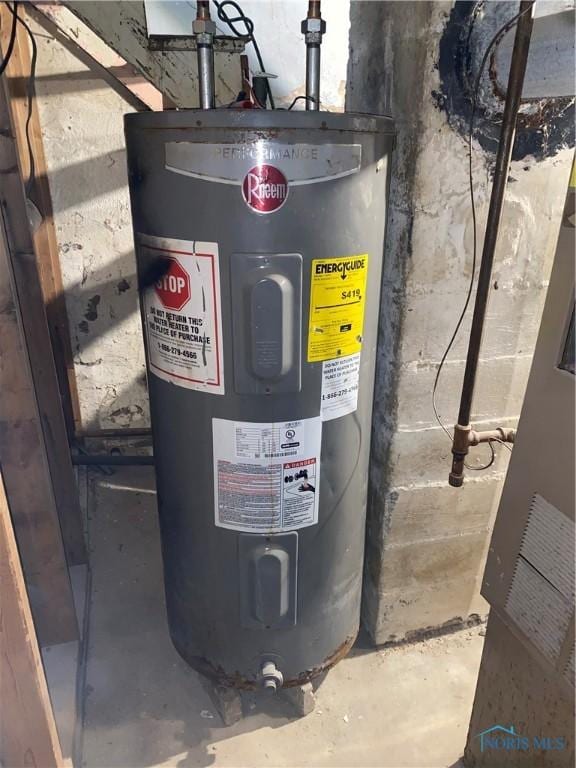 utility room featuring water heater