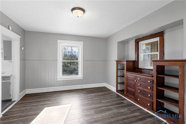 unfurnished dining area with dark hardwood / wood-style flooring