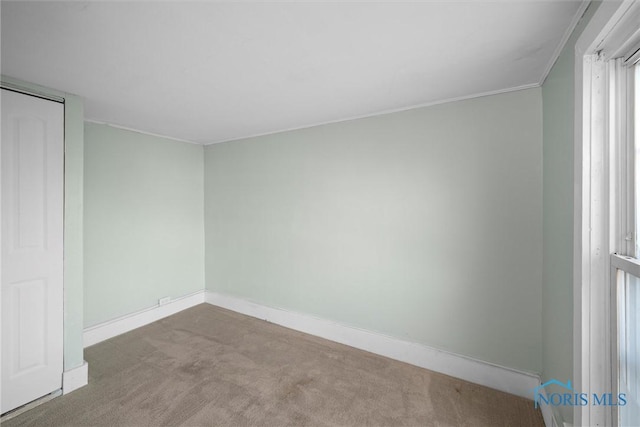 unfurnished bedroom featuring light carpet