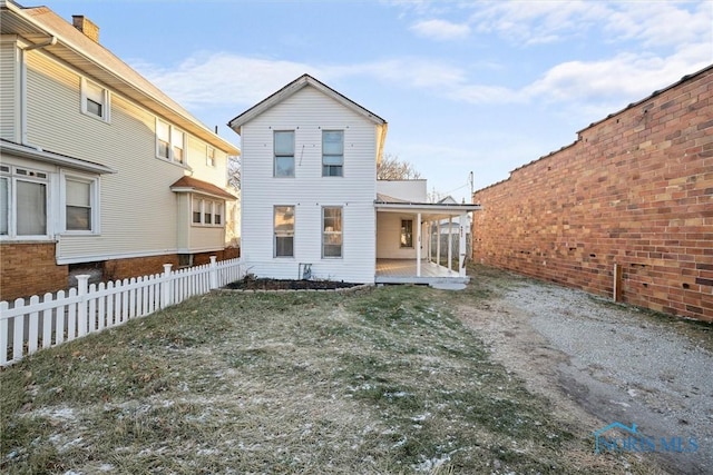 rear view of house with a patio