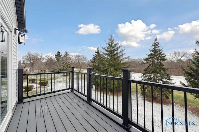 wooden terrace with a water view