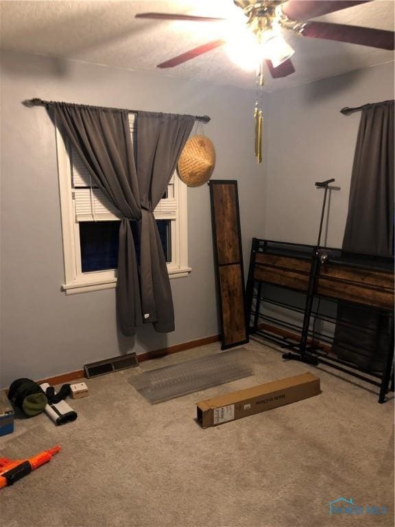 unfurnished bedroom with carpet flooring and ceiling fan