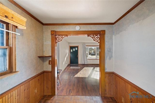 hall featuring dark parquet floors and ornamental molding