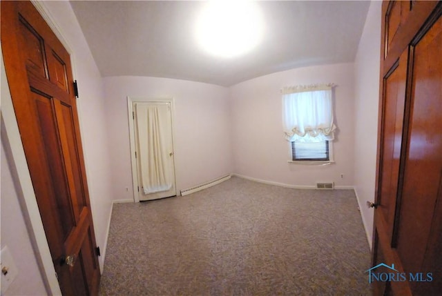 interior space featuring brick ceiling, carpet flooring, lofted ceiling, and a baseboard radiator