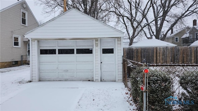 view of snow covered garage