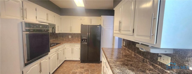 kitchen with tasteful backsplash, white cabinets, and black appliances