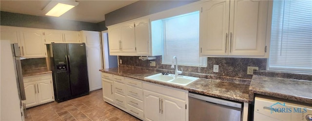 kitchen featuring sink, stainless steel dishwasher, fridge, black fridge with ice dispenser, and white cabinetry