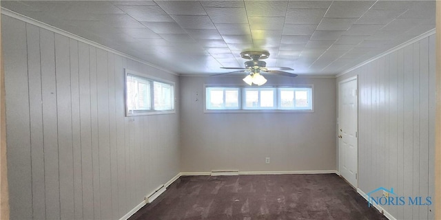 carpeted empty room featuring ceiling fan and ornamental molding