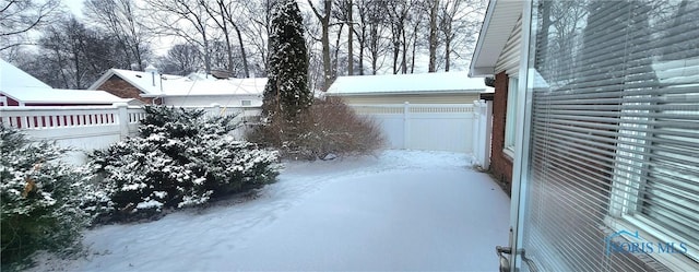 view of yard covered in snow