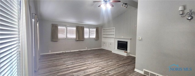 unfurnished living room with ceiling fan, dark hardwood / wood-style flooring, a fireplace, and vaulted ceiling