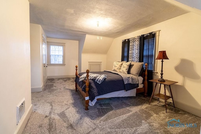 bedroom with carpet, a textured ceiling, and vaulted ceiling