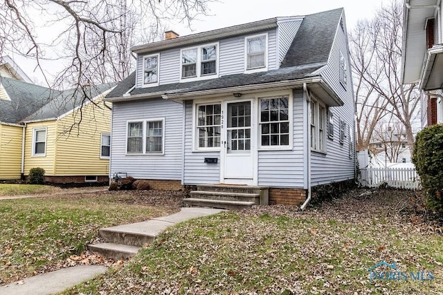 view of front of property with a front lawn