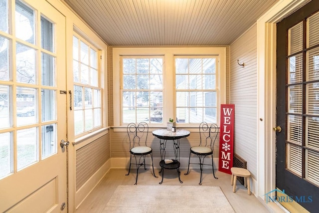 sunroom / solarium featuring wood ceiling