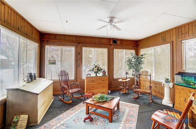 sunroom / solarium with plenty of natural light and ceiling fan