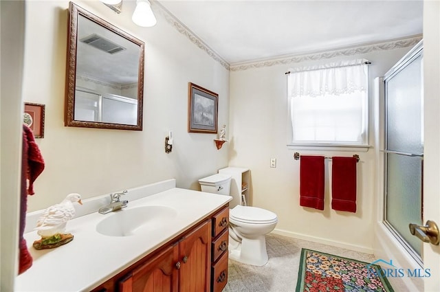 full bathroom featuring shower / bath combination with glass door, vanity, and toilet