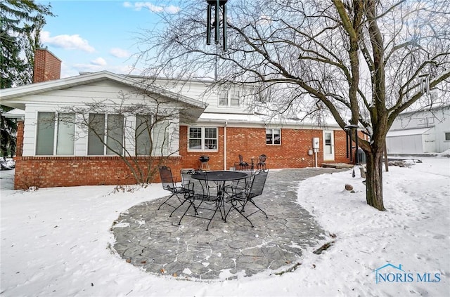 view of snow covered house