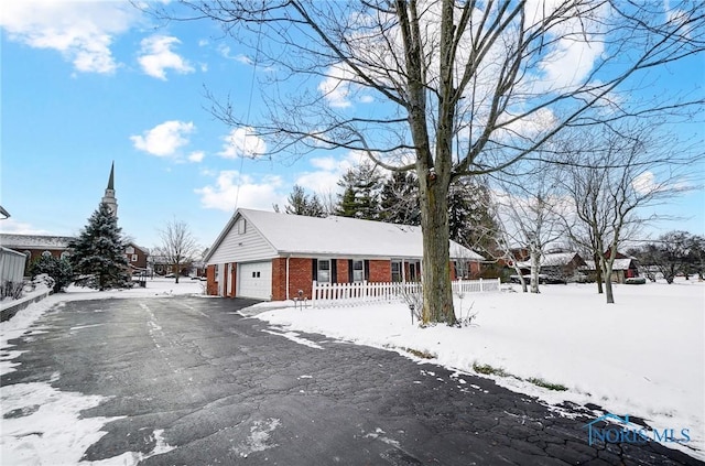 single story home with a garage