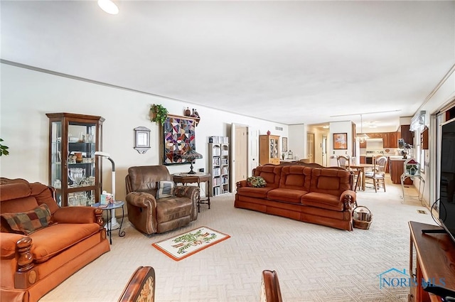 carpeted living room featuring crown molding