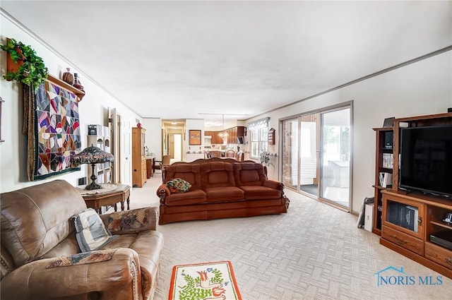 carpeted living room featuring crown molding