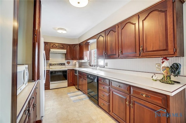 kitchen with sink and white appliances