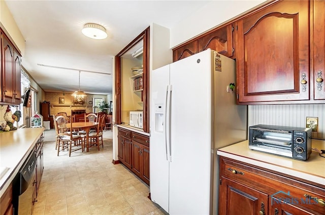 kitchen with pendant lighting and white appliances