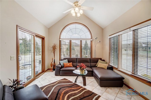 living room with a wealth of natural light, light tile patterned floors, and lofted ceiling