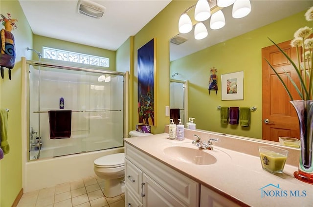 full bathroom featuring tile patterned floors, toilet, vanity, and combined bath / shower with glass door