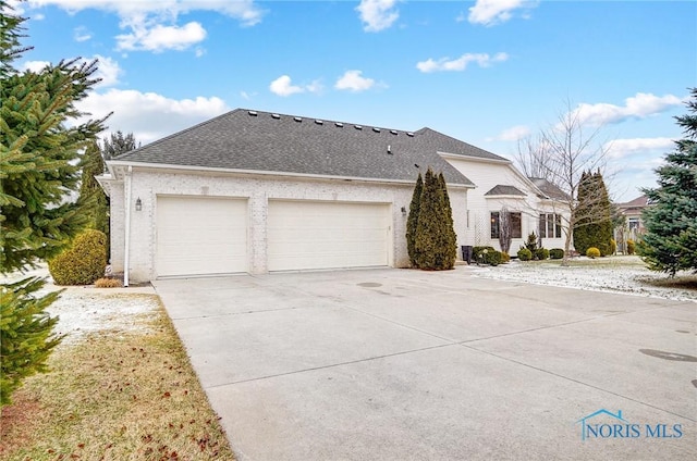 ranch-style home featuring a garage