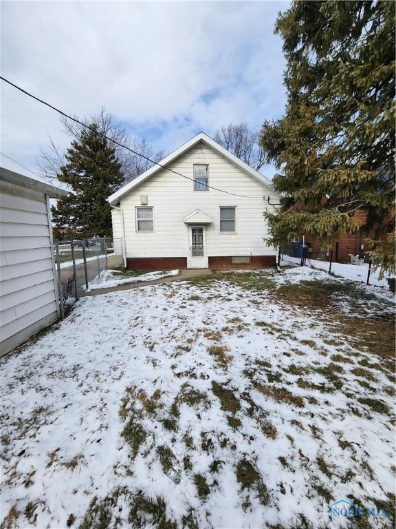 view of snow covered house