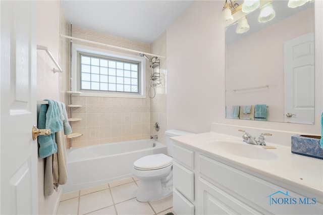 full bathroom with vanity, tile patterned flooring, tiled shower / bath combo, and toilet