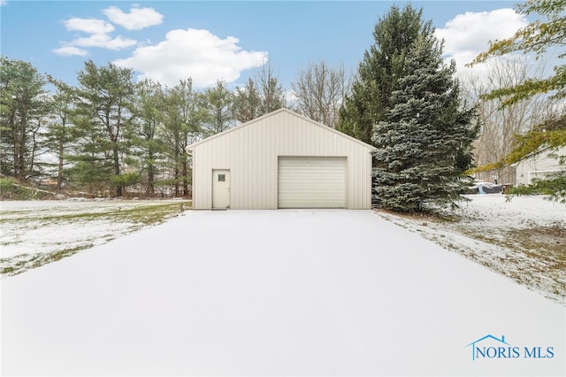 view of snow covered garage