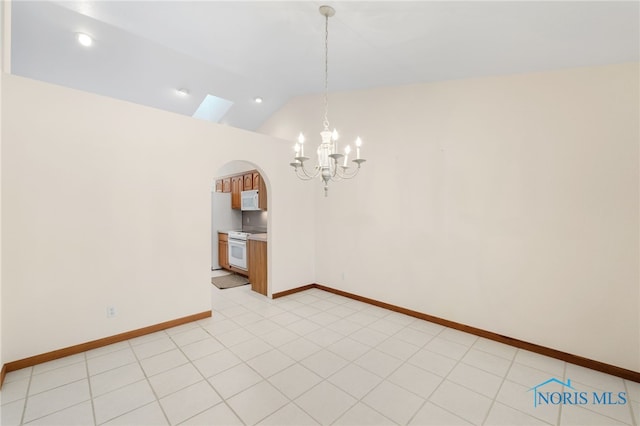 unfurnished room featuring a notable chandelier and lofted ceiling