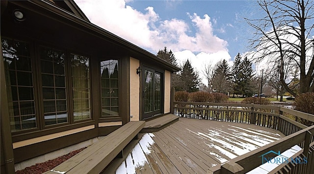 view of snow covered deck