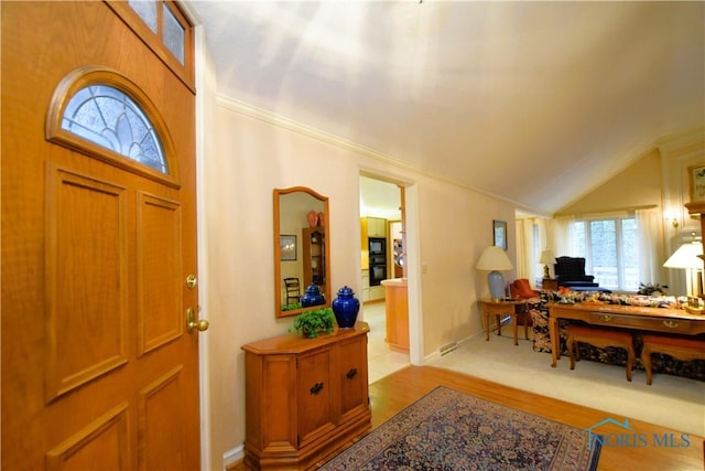 foyer featuring light hardwood / wood-style flooring and lofted ceiling