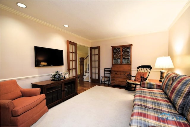 living room featuring crown molding and french doors