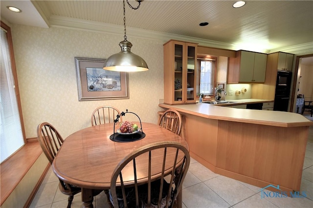 tiled dining area with ornamental molding and sink