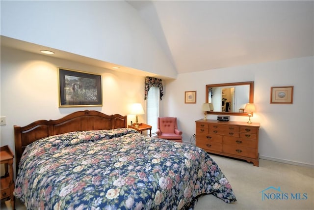 bedroom featuring light carpet and high vaulted ceiling