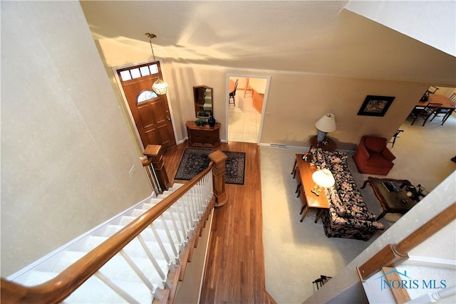 entryway with hardwood / wood-style flooring