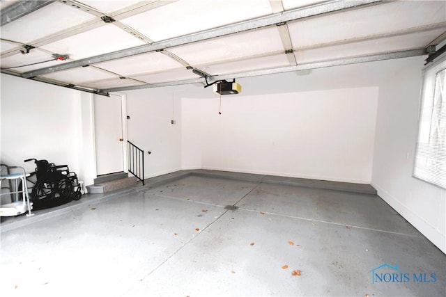 garage featuring a garage door opener