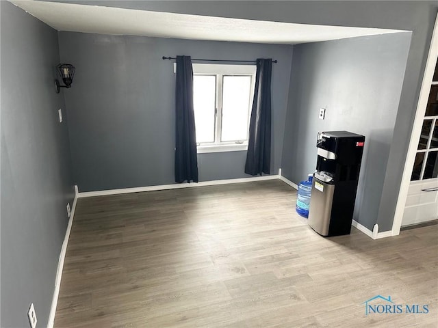 spare room featuring light wood-type flooring